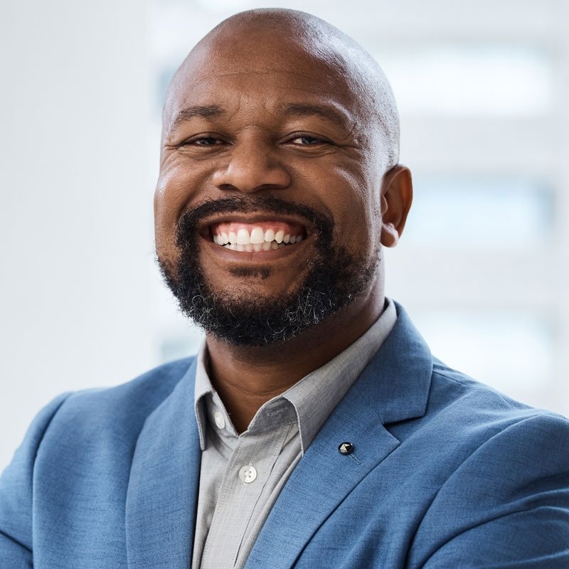Portrait Of A Confident Mature Businessman Standing With His Arms Crossed In An Office 1