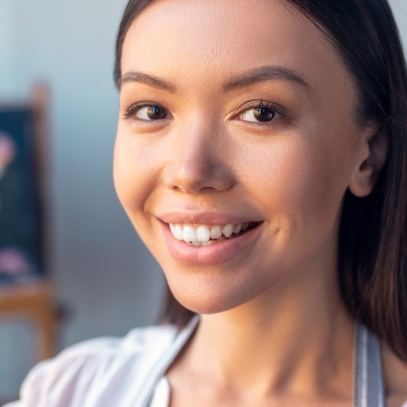Positive Happy Woman Showing Her Beautiful Paintin 2023 11 27 05 23 21 Utc
