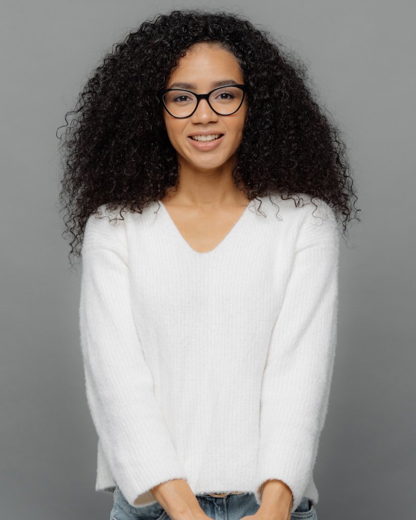 Satisfied African American Woman Keeps Hands Toget D5NXSJP