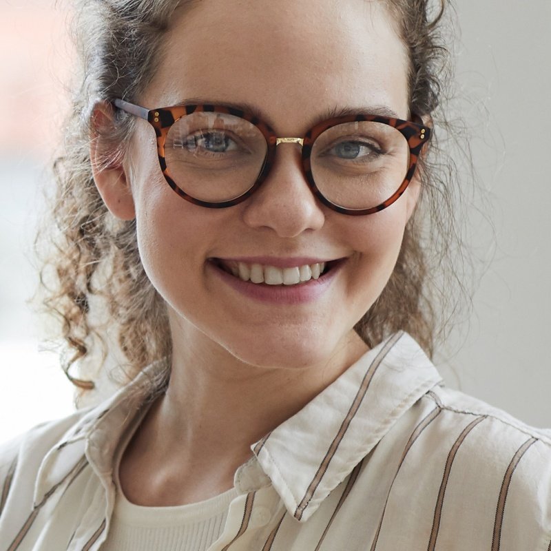 Smiling Female Photographer Posing At Desk 2023 11 27 05 26 20 Utc